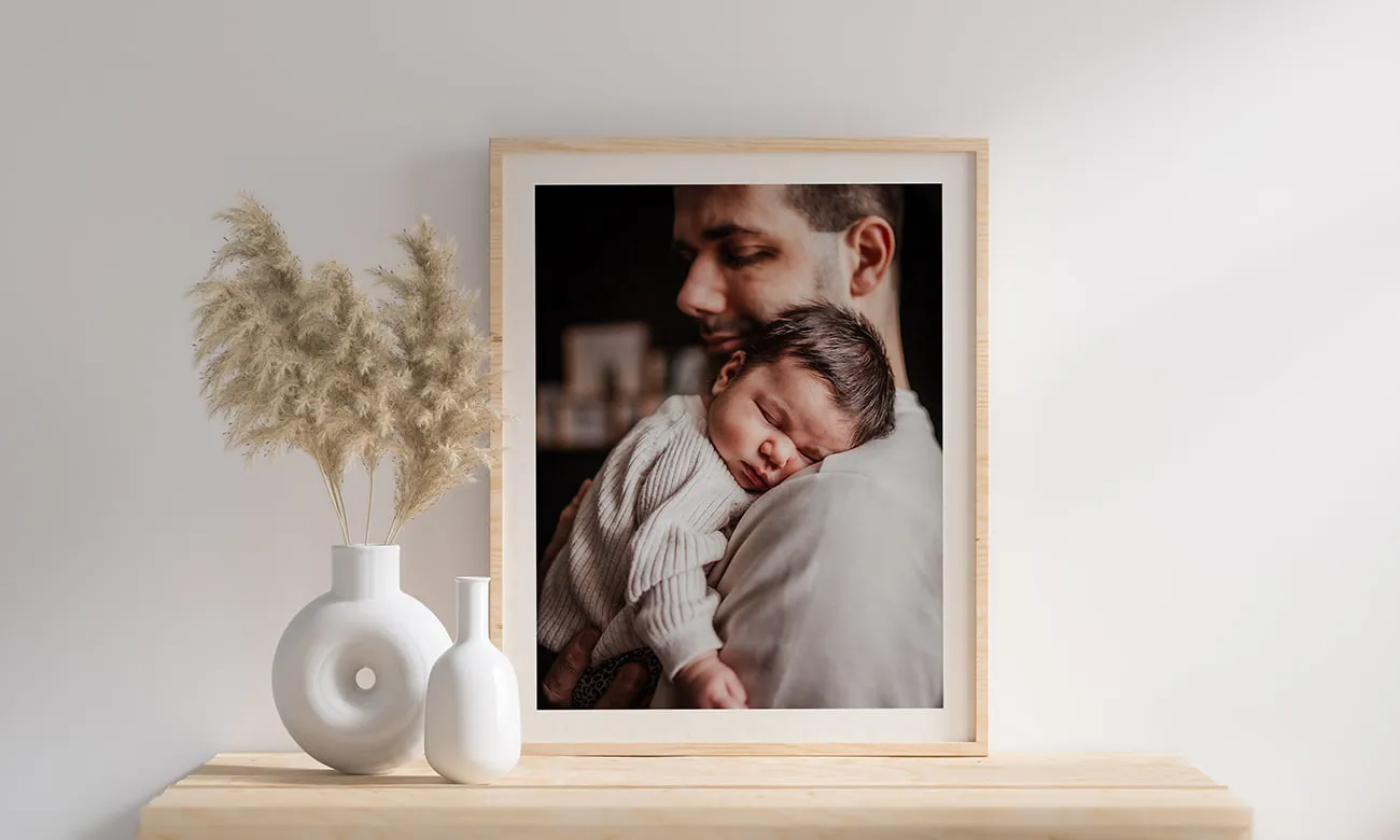 Voorbeeld van Foto’s laten afdrukken en elke dag te genieten van papa samen met de baby.